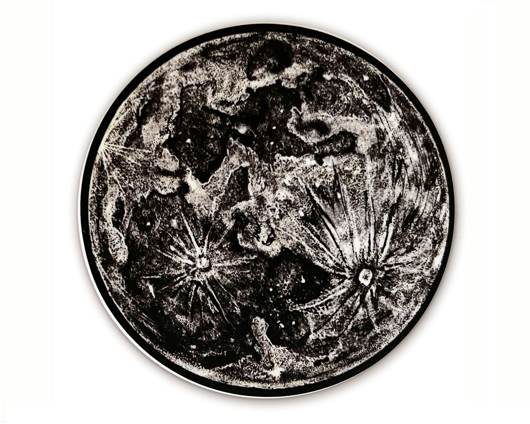 A black and white image of a Full Moon Sticker by The Wild Wander.