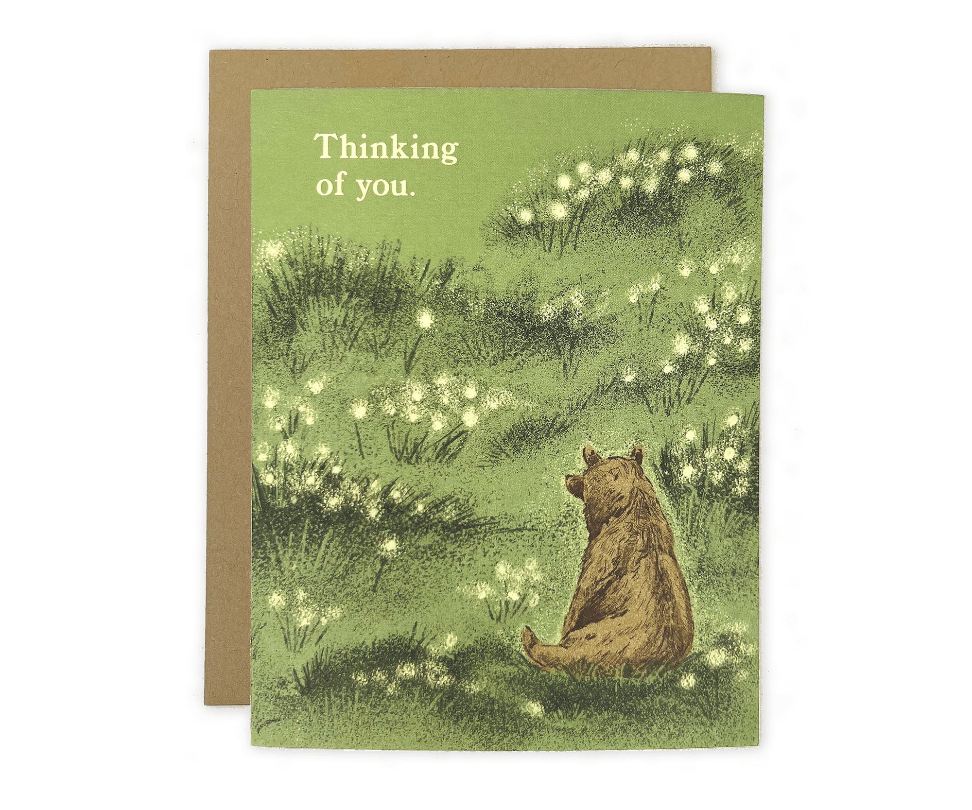 A Thinking of You Bear Greeting Card by The Wild Wander with a bear sitting in a field of dandelions.