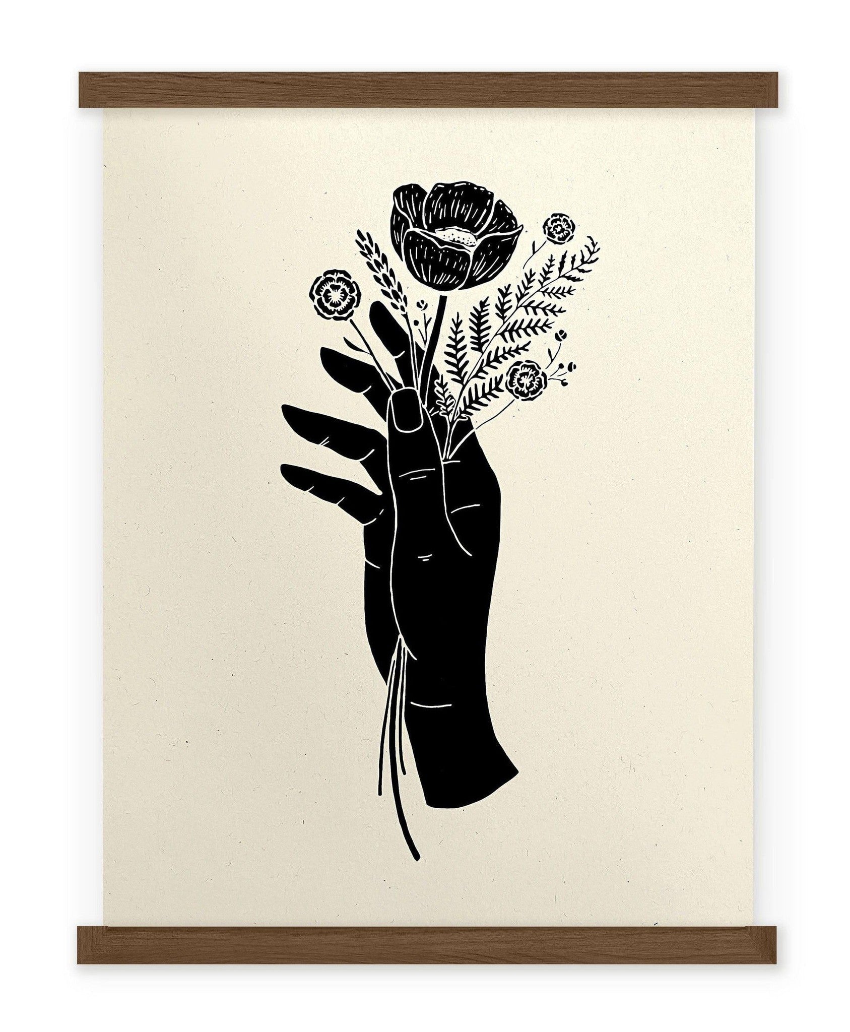 A black and white drawing of a Botanical Hand Print by The Wild Wander holding a flower.