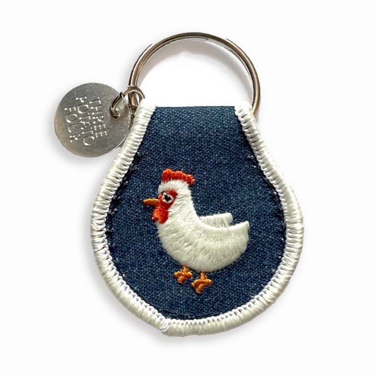 A Three Potato Four Patch Keychain - Chicken with a chicken on it.