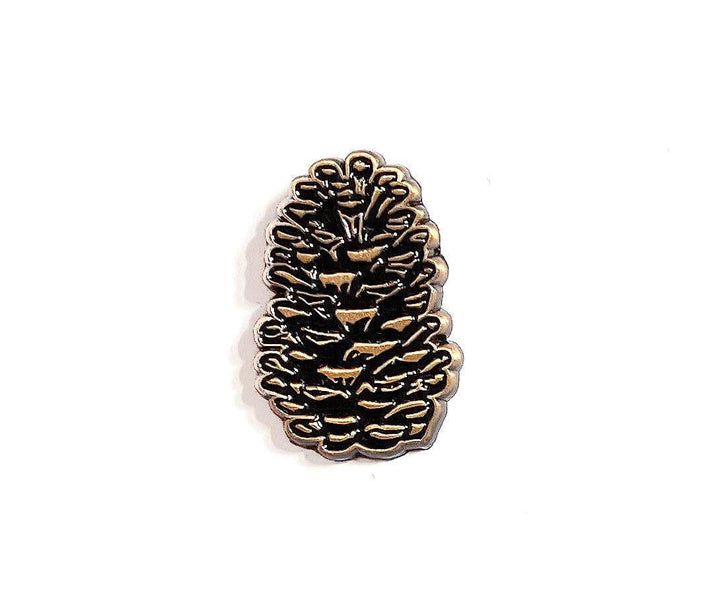 The Wild Wander Pinecone Enamel Pin.