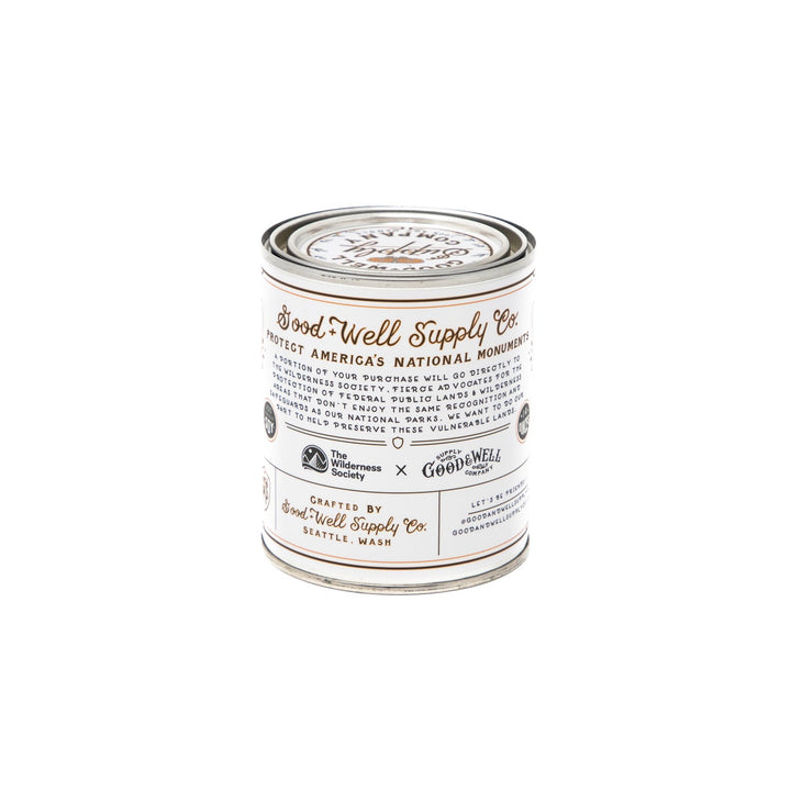A tin with a white label on it, containing the Cascade-Siskyou Candle by Good & Well Supply Co.