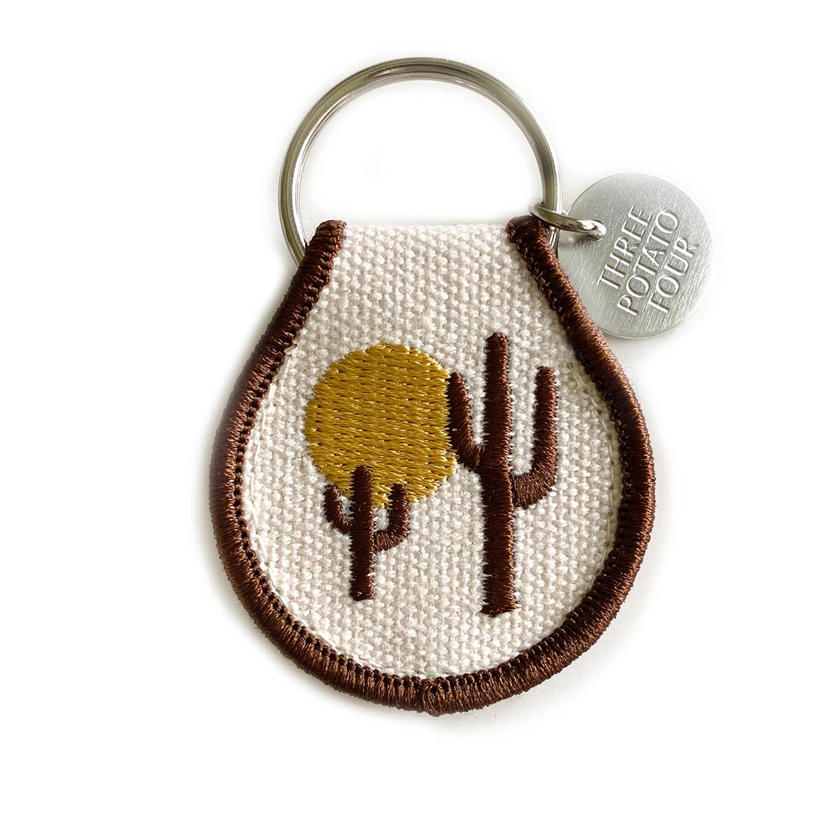 A Patch Keychain - Desert Vibes by Three Potato Four with a cactus on it.