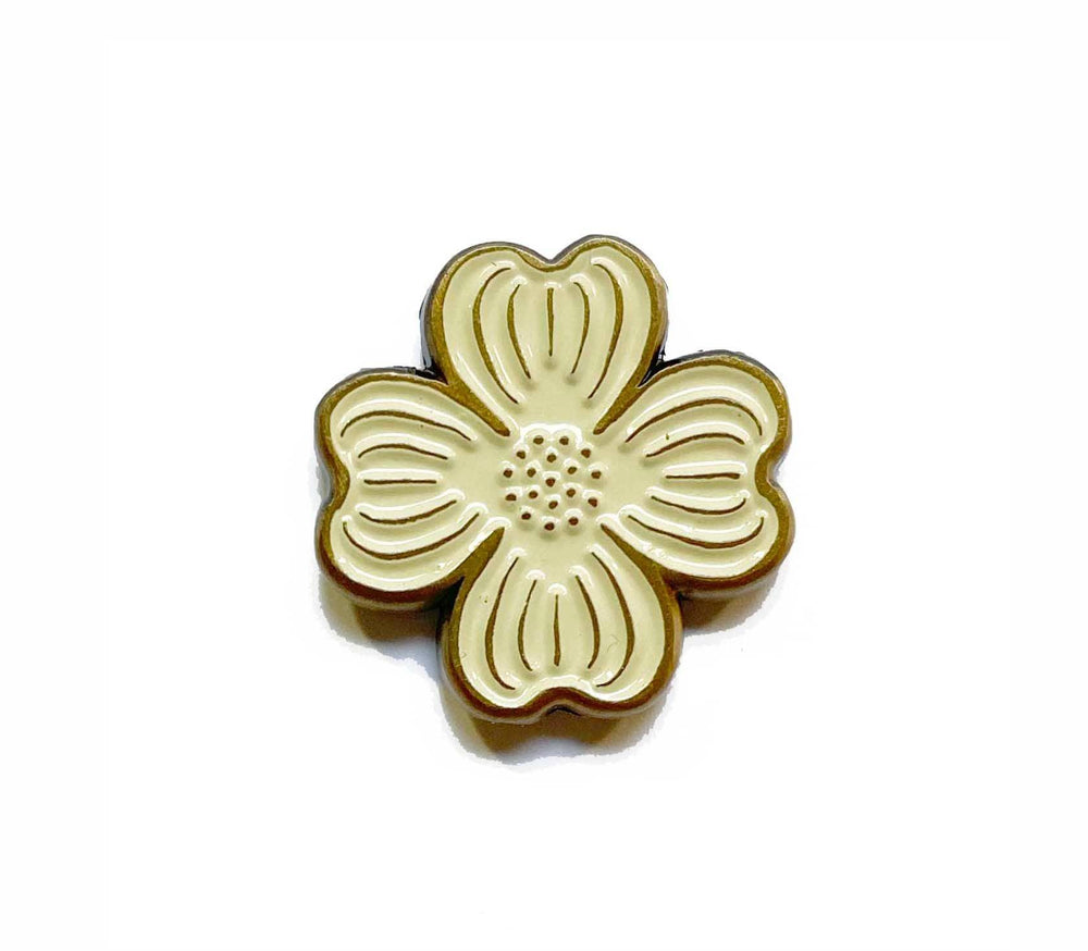 A brown Dogwood Enamel Pin button on a white background from The Wild Wander.