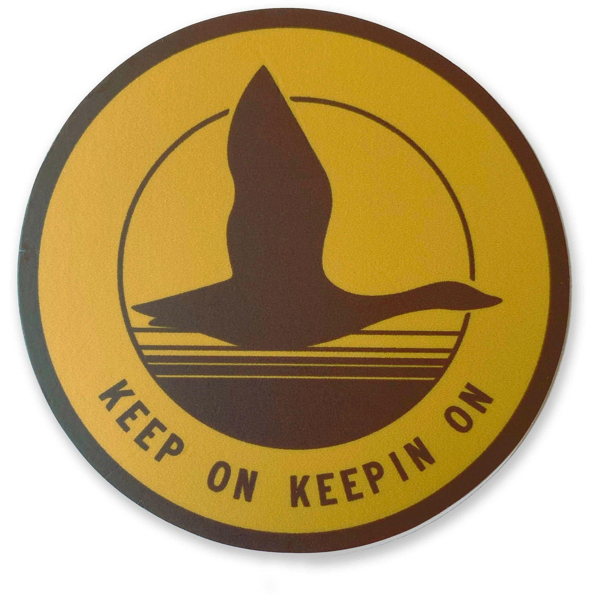 A yellow and brown Keep on Goose Sticker with The Wild Wander brand.