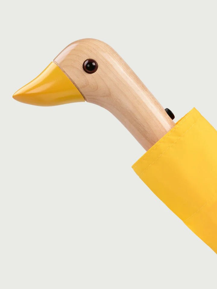 An Original Duckhead Yellow Umbrella with a duck head on it.